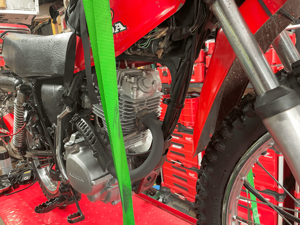 1979 Honda XL125s, during the rebuild: engine on the lift