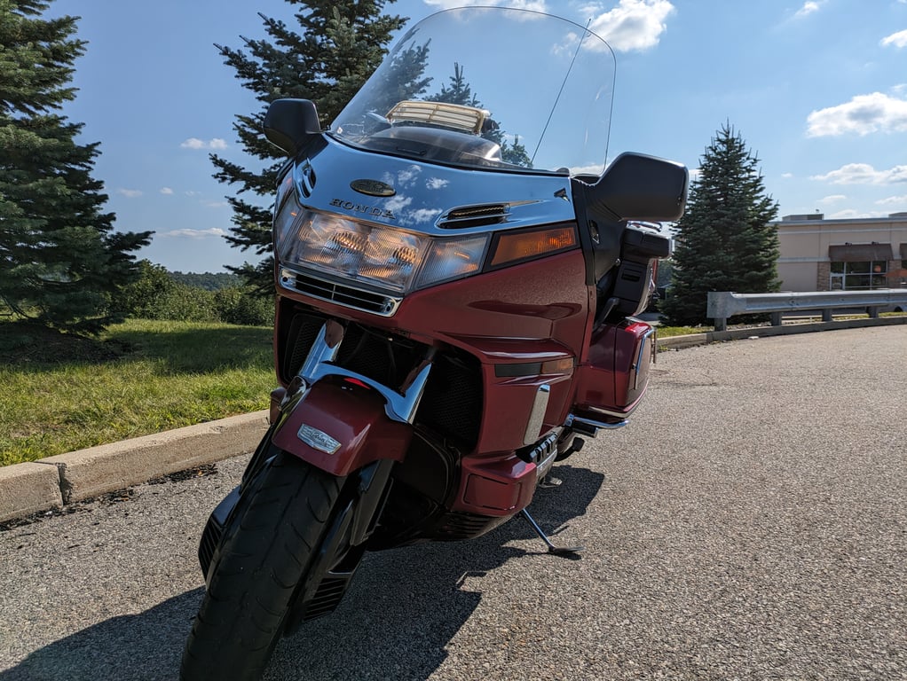 1995 red Honda Gold Wing GL1500 Interstate: red Gold Wing, front three-quarter view outdoors