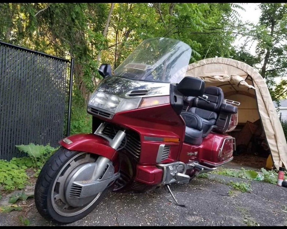 1995 red Honda Gold Wing GL1500 Interstate, before restoration: three-quarter view outdoors
