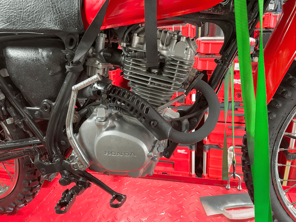 1979 Honda XL125s, during the rebuild: engine on the lift