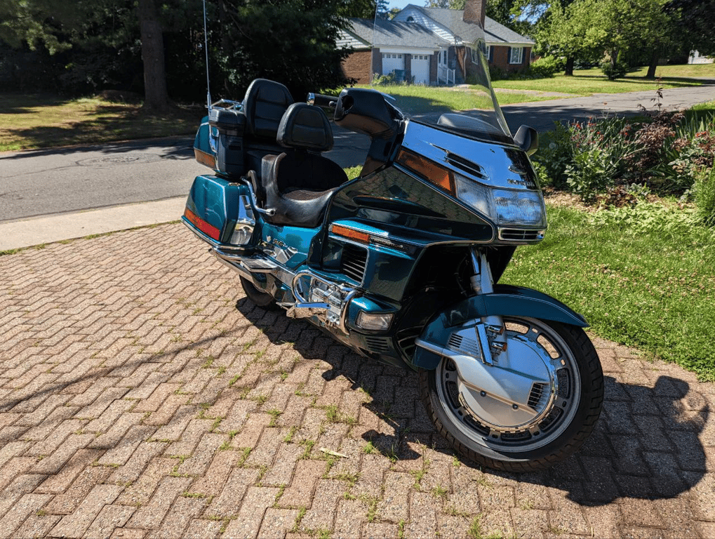 1995 Honda Gold Wing GL1500 Interstate: green Gold Wing, three-quarter view on a brick driveway