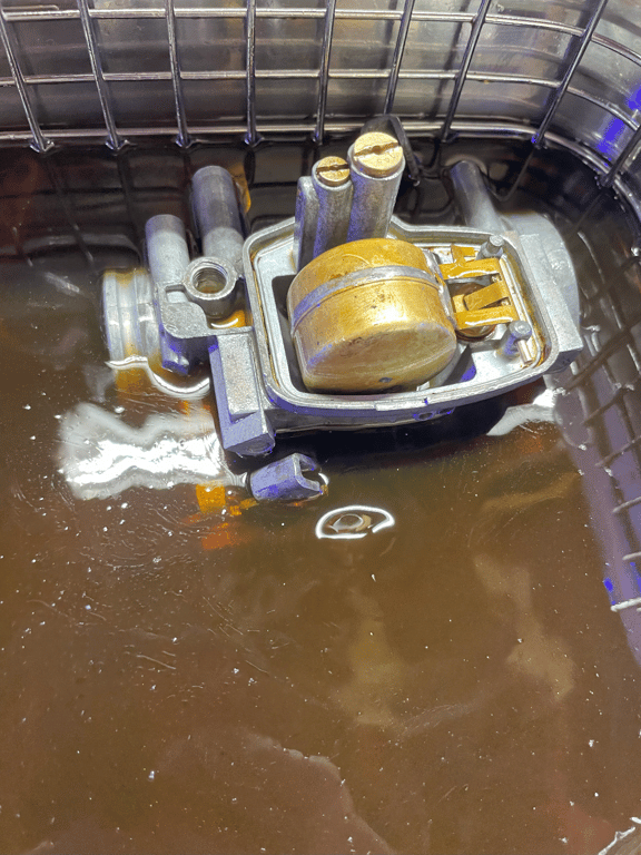 1974 Honda CB450 K4 “Krusty”, before restoration: carburetor parts soaking in a cleaning tank