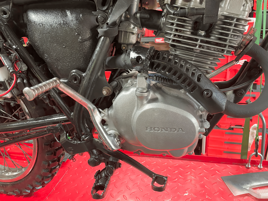 1979 Honda XL125s, during the rebuild: engine and footpegs on the lift