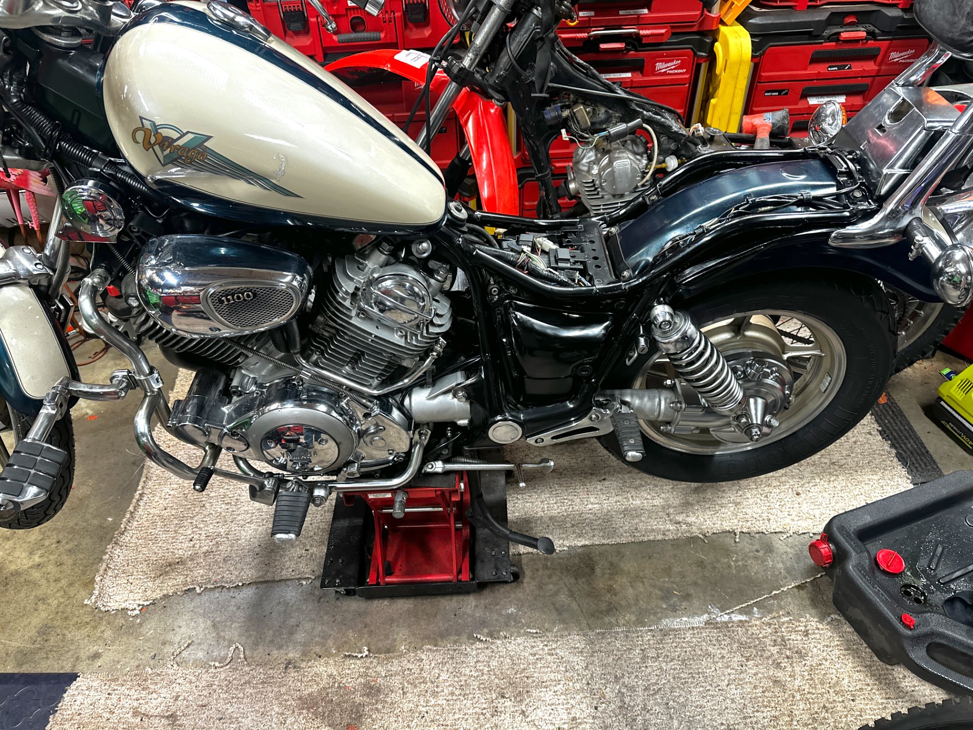 1995 Yamaha Virago 1100, restoration in progress: side view on the lift
