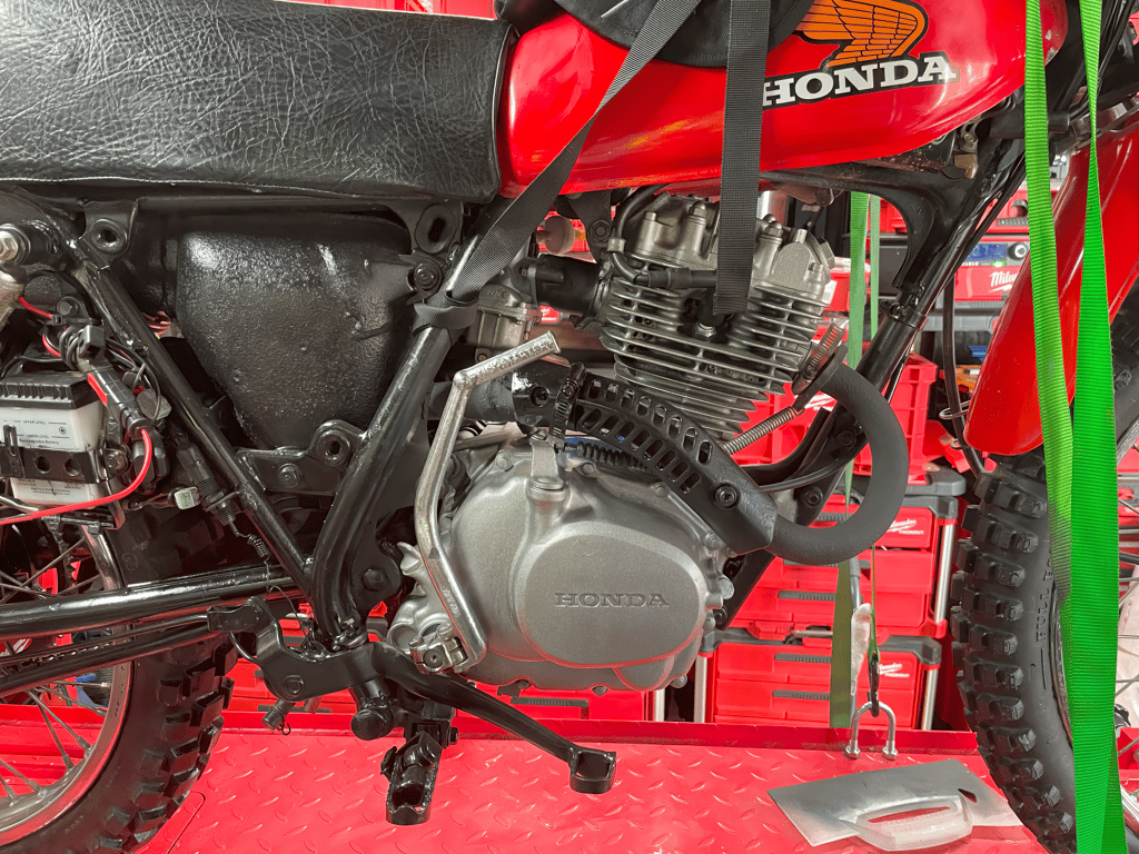 1979 Honda XL125s, during the rebuild: engine on the lift